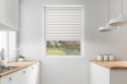 Roller blind in PVC cassette with a guide EX light brown 76