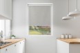 Blackout roller blind in PVC cassette with a guide light gray 064